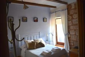 Postel nebo postele na pokoji v ubytování Castillo de Grisel