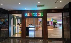 a store with a sign on the front of it at Grand Sapphire 2 bedroom in Saint Yeorgios