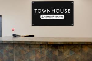 a sign that reads town house company startled at Super Townhouse ISBT Vijay Nagar Jabalpur in Jabalpur