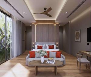 a bedroom with a bed and a ceiling fan at Ramada Resort by Wyndham Khao Lak in Khao Lak
