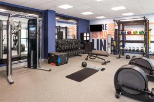 a gym with lots of equipment in a room at Hampton Inn Minneapolis-Roseville,MN in Roseville
