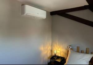 a bedroom with a bed with a white pillow at Heol - La bonne Étoile 