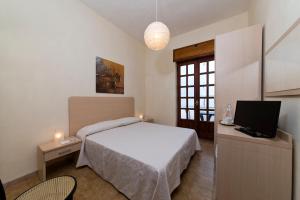 Säng eller sängar i ett rum på Casa Di Meglio Dependance