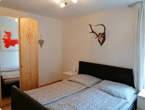 a bedroom with a bed in a room at Family Apartment Sonja Terrace & mountain view in Rauris