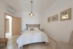 A bed or beds in a room at B&B Villa Cinzia