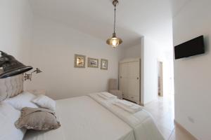 A bed or beds in a room at B&B Villa Cinzia