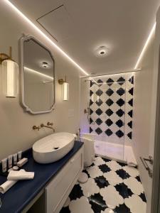 a bathroom with a sink and a mirror at Lussi Capri in Anacapri