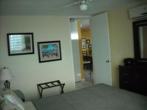 A bed or beds in a room at Ocean Front Apartment