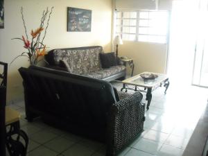 A seating area at Ocean Front Apartment