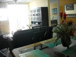 A television and/or entertainment centre at Ocean Front Apartment