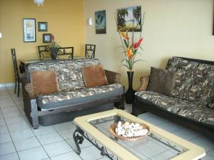 A seating area at Ocean Front Apartment
