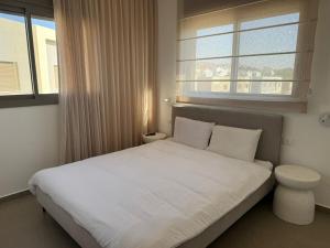 Postel nebo postele na pokoji v ubytování DreamyRent Aqua Sol Eilat + 11 fotografií