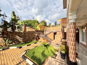 a courtyard of a house with a garden at Family Corner Suite by Iwacu Stays in Kigali +5 photos