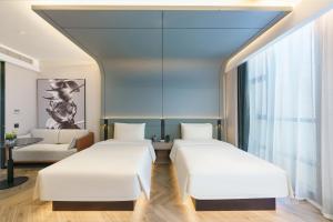 Postel nebo postele na pokoji v ubytování Atour S Hotel Shenyang Youth Avenue Municipal Government Square