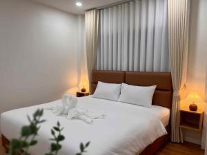 Llit o llits en una habitació de A RISA hometel cafe