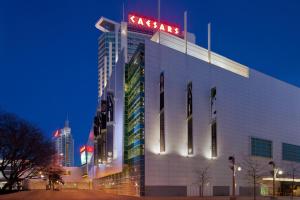 a building with a sign on top of it at night at Caesars Windsor Hotel & Casino - A Caesars Rewards Destination in Windsor
