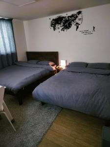 Postel nebo postele na pokoji v ubytování 코즈하우스Coze house