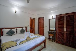 Ένα ή περισσότερα κρεβάτια σε δωμάτιο στο Service Appartment baga