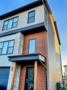a house with a brown and white at Your Halifax Getaway, Relax and Explore in Halifax