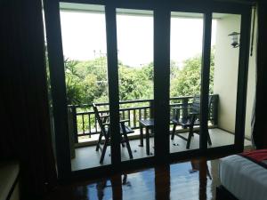 Rõdu või terrass majutusasutuses Yodia Heritage Hotel