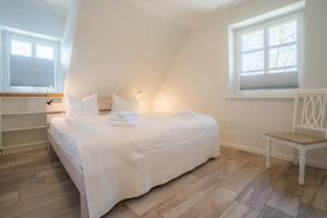 Un pat sau paturi într-o cameră la Haus Oase +12 fotografii