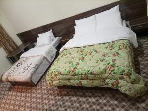 Katil atau katil-katil dalam bilik di Shisper View Hotel