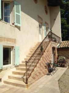 a house with stairs and a table and chairs at Coeur De Beaujolais in Corcelles-en-Beaujolais +7 photos