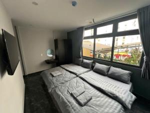 Ένα ή περισσότερα κρεβάτια σε δωμάτιο στο Dalat Family Center