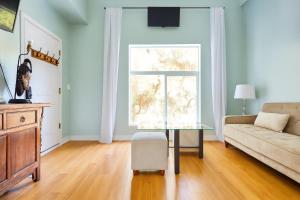 a living room with a couch and a table at Malibu 2BR In Woods Close To Beach in Malibu