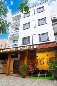 a building with a sign that reads the performance hotel restaurant and bar at The Prominence Hotel Restaurant & Bar in Greater Noida