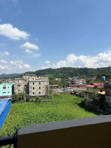 a view of a city with buildings and trees at DXK Villa Homestay in Guwahati