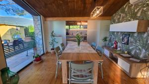 a kitchen and dining room with a table and chairs at A Casa di Alice Assisi in Santa Maria degli Angeli