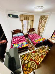 Ένα ή περισσότερα κρεβάτια σε δωμάτιο στο سان هوتيل للشقق الفندقيه