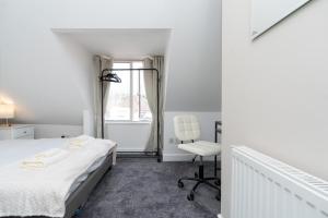 Ένα ή περισσότερα κρεβάτια σε δωμάτιο στο Open Mind Property - 8 Guests & Free Parking +18 φωτογραφίες