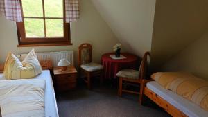 Ένα ή περισσότερα κρεβάτια σε δωμάτιο στο Ferienwohnungen Ihle