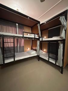 two bunk beds are in a room at Basil Hostel in Muscat +21 photos