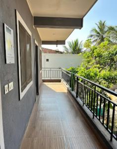 a balcony of a house with a view at Hotel Aram Palace in Calangute