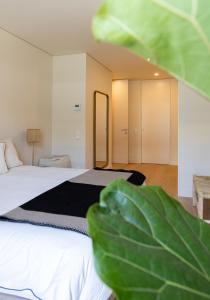 En eller flere senge i et værelse på Ocean Living by MP + 45 billeder