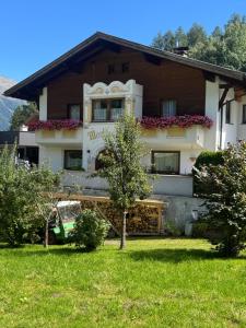 a house with a car parked in front of it at Martinshof Ladis in Ladis