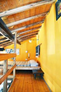 a bedroom with two bunk beds and a wooden ceiling at Casa Con Soppalco ad Ariccia in Ariccia