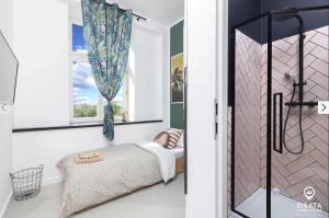 a small bedroom with a bed and a window at Agroturystyka SIESTA in Wola Chojnata
