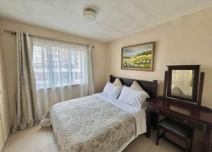 Ένα ή περισσότερα κρεβάτια σε δωμάτιο στο Summersands North Beach Durban +15 φωτογραφίες