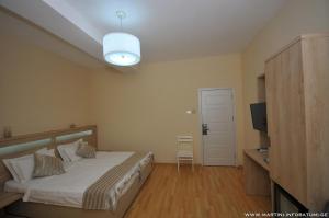 Letto o letti in una camera di Hotel Martini Kvariati