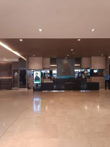 a large empty lobby with a foodcourt in a building at Haven's Suites a place like home in Manila