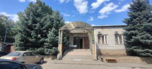 a building with an archway in front of a building at Хостел AUTOMAX in Dnipro