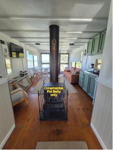 a kitchen and living room with a stove in a house at Paddle Wheeler Lilian in Mannum