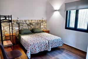 a bedroom with a bed in a room with a window at GlampINN Fuente Obejuna in Fuente Obejuna +14 photos