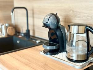 Kuchyň nebo kuchyňský kout v ubytování Wave & Wellness Studio