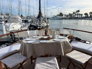 a table and chairs on a boat in the water at Xanquete in Valencia +19 photos