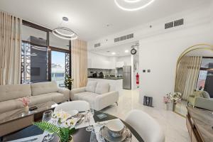 a living room with a couch and a table at Spacious 3BR Eco Stay Masdar City Abu Dhabi Near Airport & Yas Island in Abu Dhabi